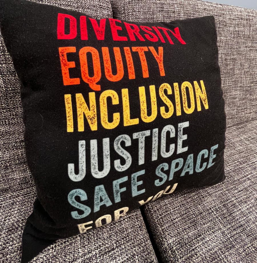 pillow cover that says diversity, equity, inclusion, justice, safe space for you